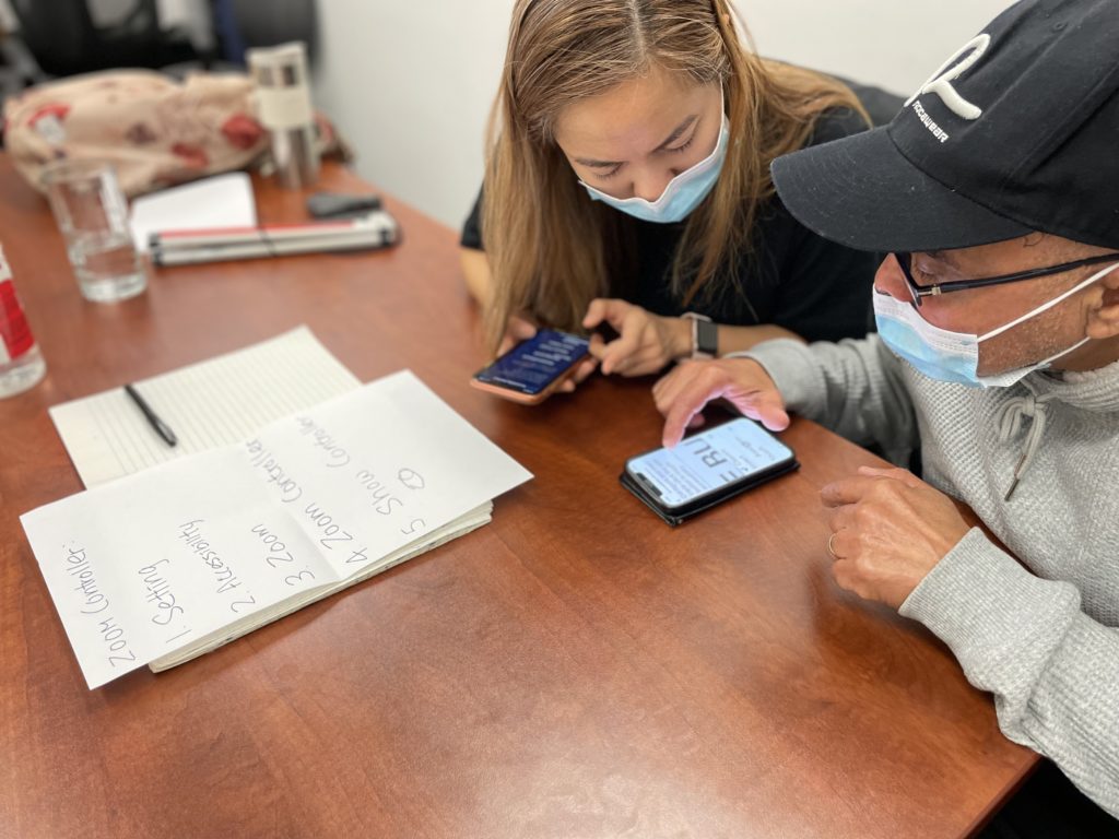 Assistive Technology instructor providing technology training to one of our clients.